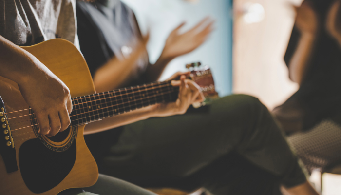 Person playing guitar