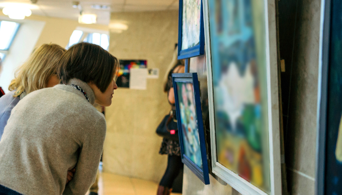 Two people looking at art.