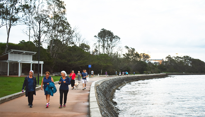 Group of staff walking in the sunset.